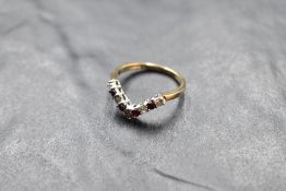 A diamond and garnet set 9ct gold wishbone ring, size Q & approx 2.6g