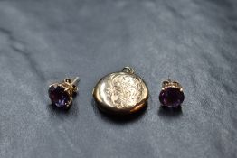 A pair of amethyst style stud earrings in rose gold mounts with backs stamped 14K, and a vintage