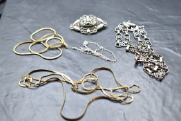 A silver necklace having moulded links with spacers and a box and tongue clasp, a silver chain, an