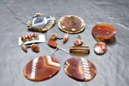A selection of agate jewellery, mainly orange stripe, including cufflinks, pendants, brooches etc