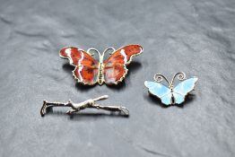 A Norwegian silver and enamel butterfly brooch by David Anderson, a silver hunting brooch in the