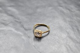 A cubic zirconia halo ring on a 9ct gold loop, size M & approx 2.1g