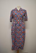 A 1940s linen day dress, having vibrant leaf pattern, cap sleeves and buttons to front, larger