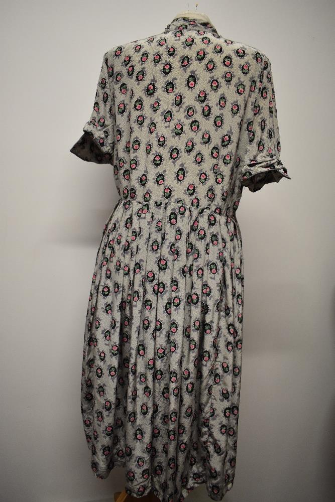 A 1940s floral day dress in a silky (most probably rayon) fabric, having buttons to front, a few - Image 6 of 7