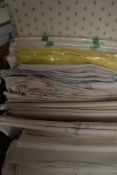 A large collection of predominantly unused vintage pillow slips, many with lovely fancy embroidery.