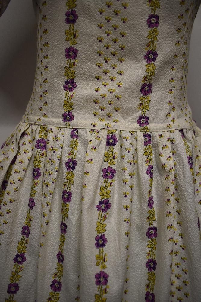 A 1950s textured floral cotton day dress, having statement collar with bow, longline bodice and full - Image 3 of 13