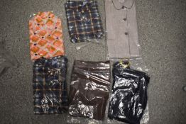 Four vintage old stock childrens tops/blouses, new in packaging and two pairs of trousers.
