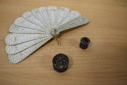 An 1867 dated dance card fan and two miniature white metal filigree caskets, one housing a silk tape