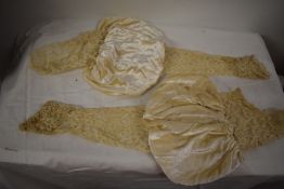 A pair of 19th century leg of mutton wedding sleeves, having lace and beaded detailing.