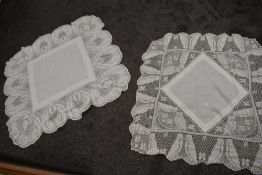 Two Mary Card style antique table clothes having deep crochet edges.