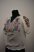 A 1930s embroidered peasant blouse.