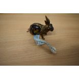 A Victorian cast metal and tortoiseshell novelty tape measure in the form of a rabbit.