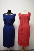 Two early 1960s day dresses, one of cerise pink lace and the other blue with white pique cotton