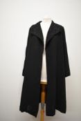 A 1930s Art Deco coat, having cutwork and embroidery to large collar and bell shaped sleeves, with