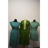 Three vintage green dresses, including mint green 1960s wool mini dress with Peter Pan collar and