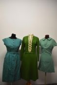 Three vintage green dresses, including mint green 1960s wool mini dress with Peter Pan collar and