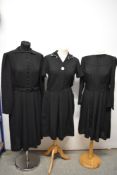 Two 1940s black dresses, one crepe and the other rayon and a 1950s black wool dress.