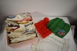 A collection of vintage antique handkerchiefs, some beautifully patterned and souvenir items amongst