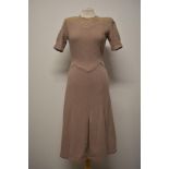 A 1930s taupe coloured wool day dress, having embroidery to bodice and pleated skirt.