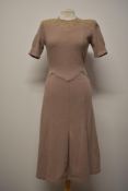 A 1930s taupe coloured wool day dress, having embroidery to bodice and pleated skirt.