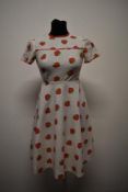 A 1950s/60s cotton dress, having strawberry print with red polka dot piping and Ric-Rac detail, back