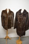 Two vintage brown fur coats, one 1960s and a shorter one, around 1930s/40s.