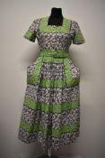 A scarce late 1940s Blanes cotton day dress with novelty print, square neckline, short sleeves,