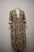 A 1940s vibrant floral linen/ linen look day dress, having modesty panel to bodice, turn up