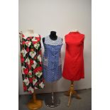 Three 1960s day dresses, including blue and white polka dot dress with pockets to front, floral