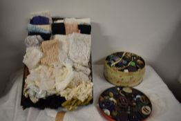 An array of vintage haberdashery to include buttons, Art Deco buckles and some good lengths of
