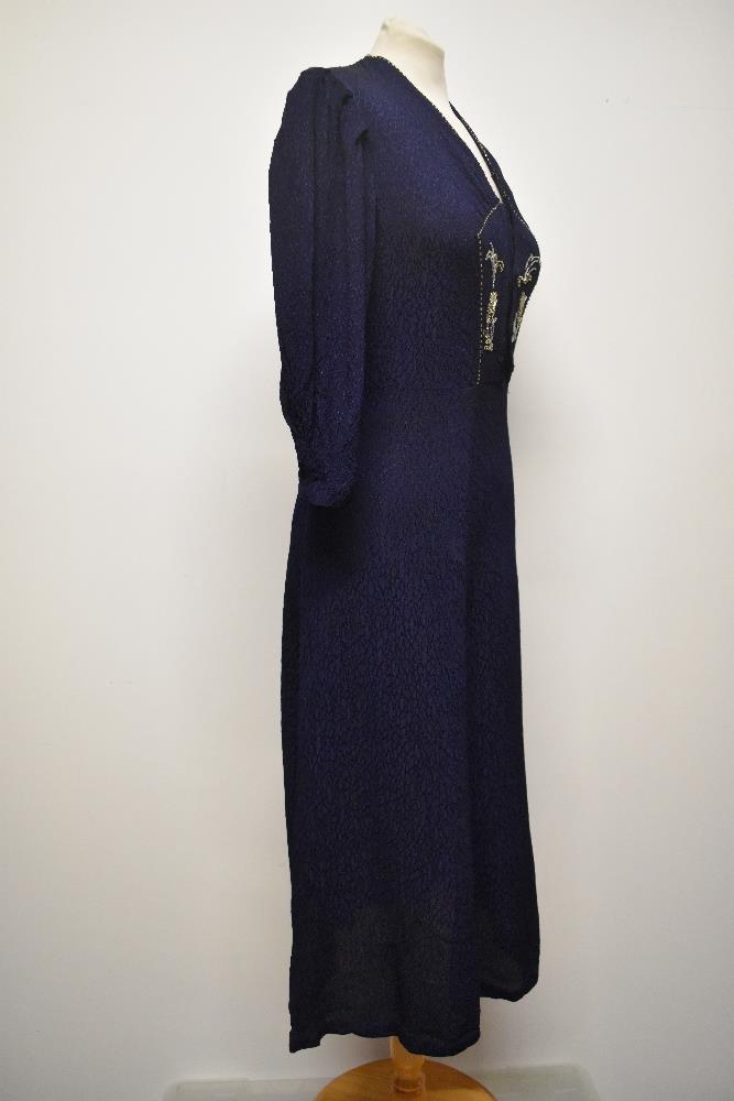 A 1940s navy blue textured crepe day dress, having 3/4 length sleeves, beadwork to bodice and - Image 5 of 6