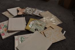 A variety of unused vintage table linen in boxes, including Irish damask.