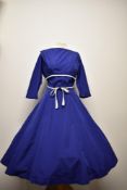 A 1950s Horrockses cotton day dress, having cobalt blue ground with contrasting white pique tie to