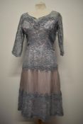 A late 1940s evening dress, having lilac taffeta lining with blue lace overlay, sweetheart