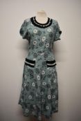 A 1950s Essander model day dress, having daisy print on mint ground with contrasting bands of