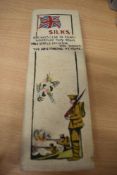 A WW1 hand painted silks case, containing a selection of skeins of embroidery threads.