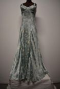 A 1930s silky bias cut night dress/slip dress, having blue floral pattern, no fastening.