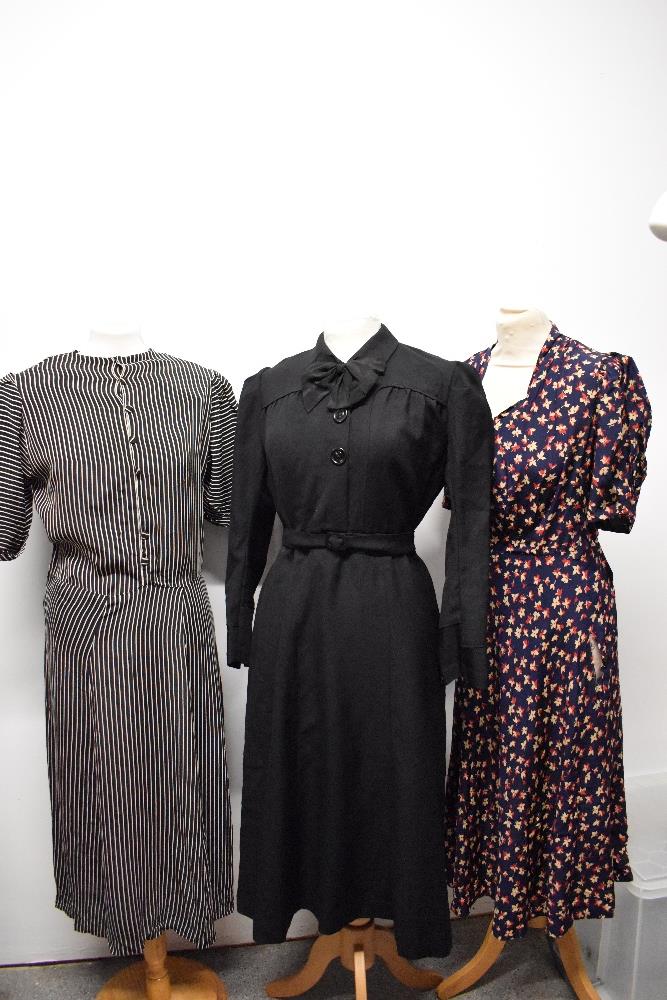 Two 1930s/1940s day dresses, one of black and white crepe in a larger size and one in black wool