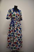 A 1950s seersucker cotton floral day dress, having contrasting cuffs and belt and similar to