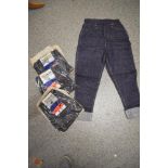 Four vintage 1960s pairs of teen/small adult denim jeans with turn ups, new in packaging.