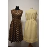 A 1960s wool pinafore in cream and a 1950s/early 60s checked brown dress with white polka dot