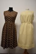 A 1960s wool pinafore in cream and a 1950s/early 60s checked brown dress with white polka dot