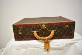 A sought after pre 1980s Louis Vuitton Alzer 50 suit case, in good order and having two keys.
