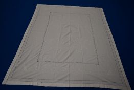 A very large antique white bed cover, having extensive raised embroidery and drawn thread work.