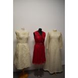 Two 1960s lace dresses, including Vera Mont Paris dress in cherry red and a 1960s wedding dress.
