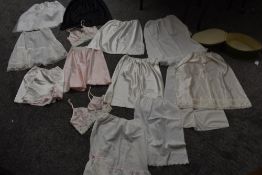 A selection of vintage and retro slips and undergarments and a nightdress case in original