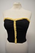 A 1950s black bustier/ sun top, having shirred back with hook and eye fastening.