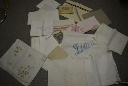 A mixed lot of antique and vintage huckaback towels (some monogrammed) pyjama and hosiery cases, a