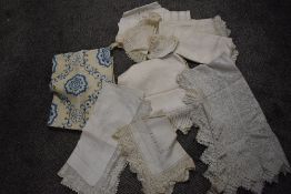 A selection of antique and vintage table linen, to included crochet edged damask tray cloths, deep