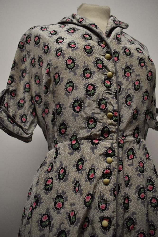 A 1940s floral day dress in a silky (most probably rayon) fabric, having buttons to front, a few - Image 4 of 7